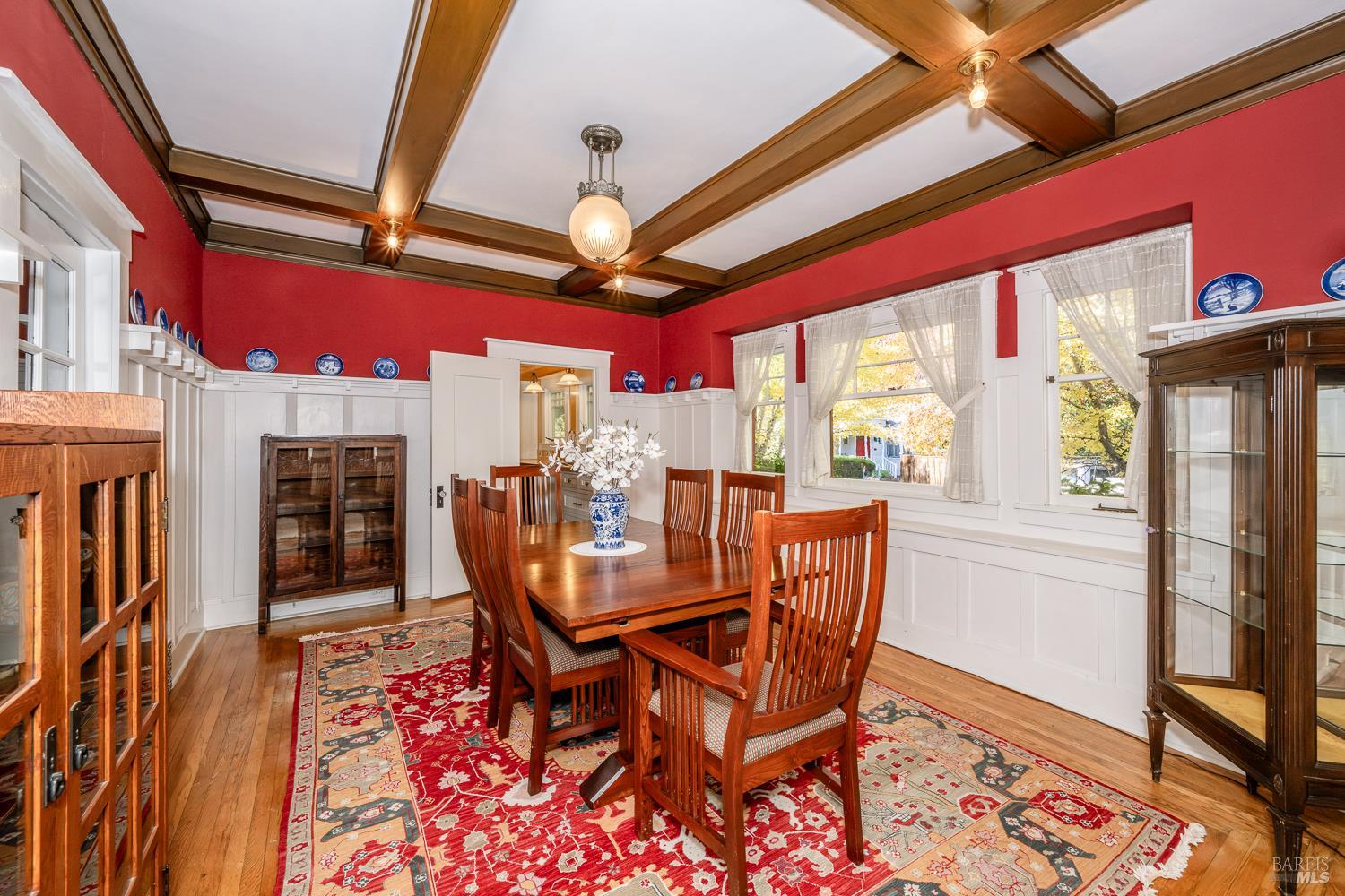 721 Spring Street Santa Rosa, CA 95404 - Photo 10 of 32 a dining room with furniture a fireplace and wooden floor