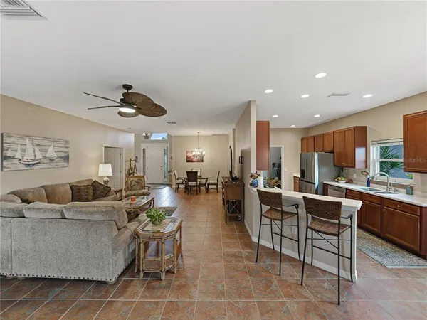 a large kitchen with stainless steel appliances lots of counter space and a sink