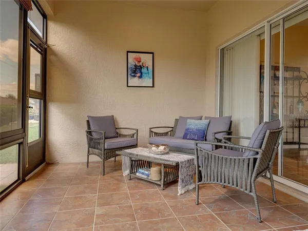 a view of a chairs and table in a room