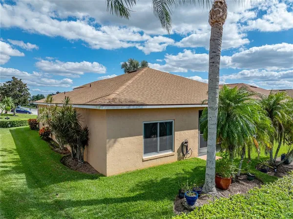 a large kitchen with a table and chairs