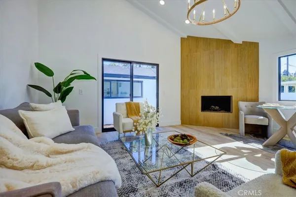 a living room with furniture flowerpot and window