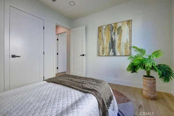 a bedroom with a bed and a walk in closet