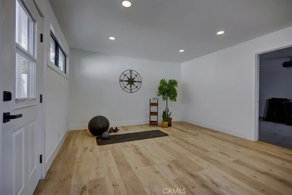 a view of a room with windows and cabinet