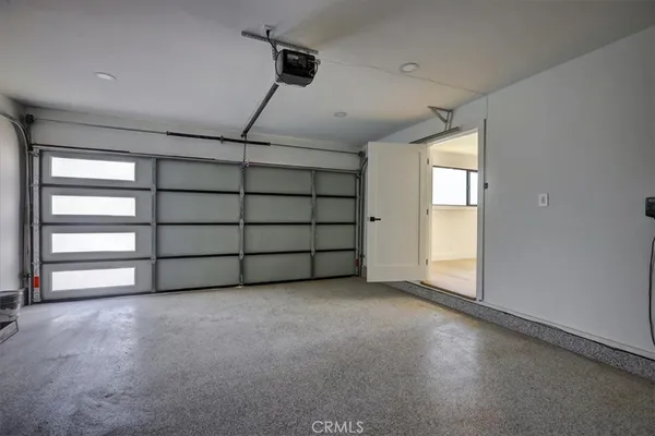 a view of an empty room with a garage