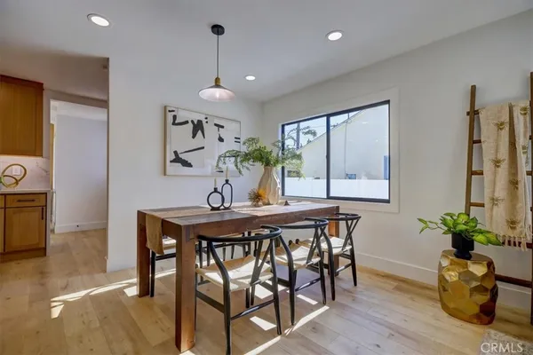 a kitchen with granite countertop a sink cabinets stainless steel appliances and a counter top space