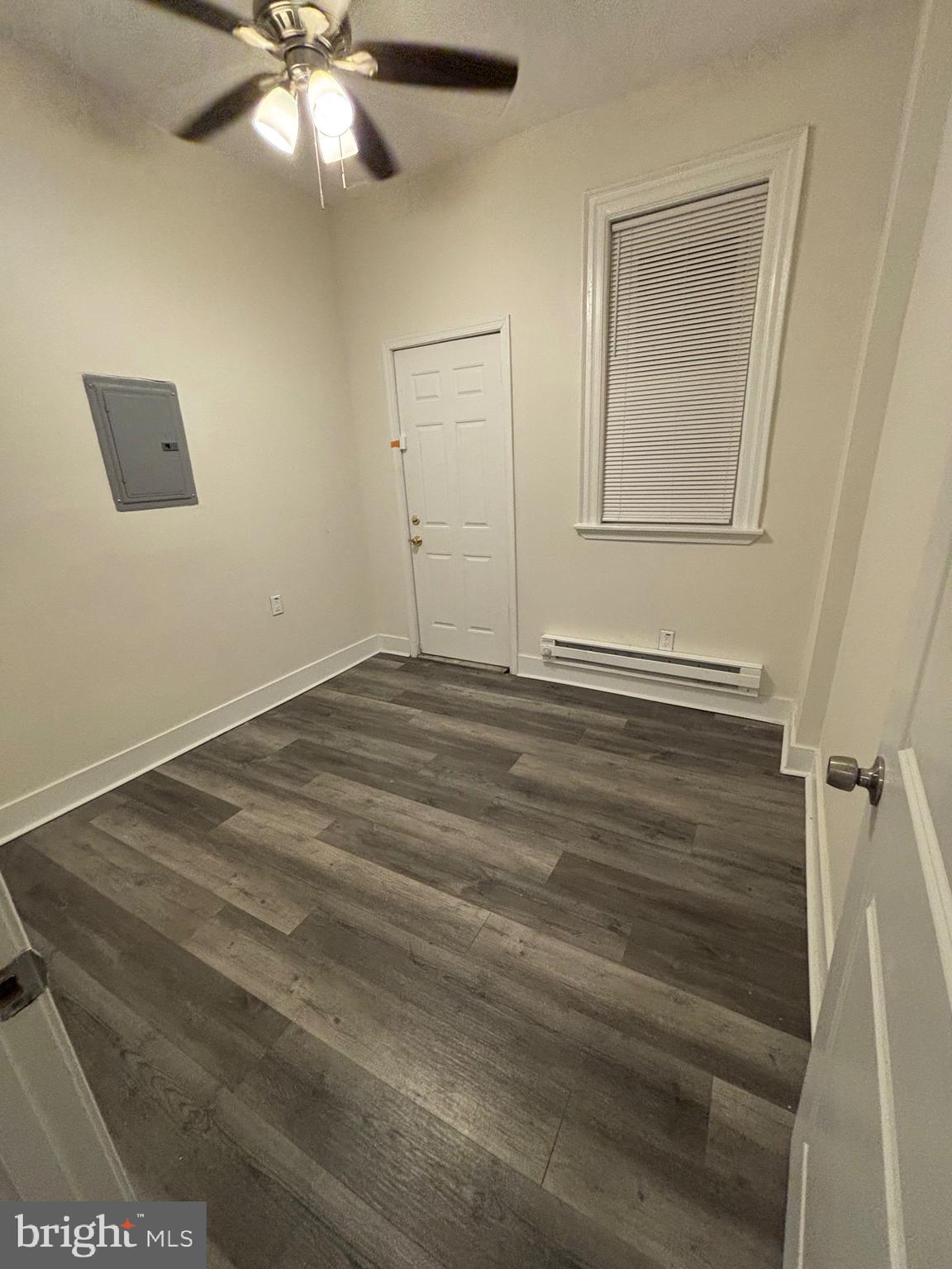 5427 Walnut Street, Unit F1 Philadelphia, PA 19139 - Photo 21 of 22 en empty room with wooden floor and fan