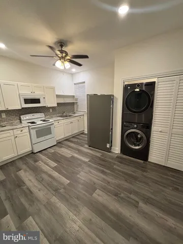 a kitchen with a stove and a refrigerator