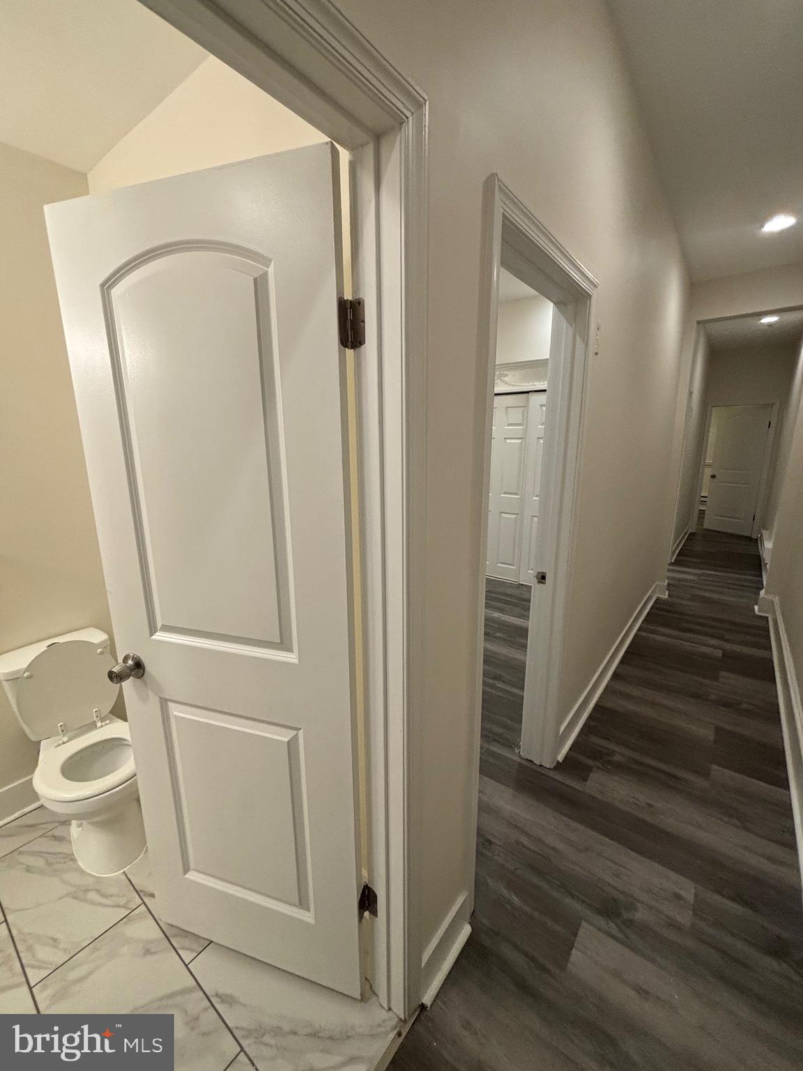 5427 Walnut Street, Unit F1 Philadelphia, PA 19139 - Photo 10 of 22 a view of a hallway with wooden floor and glass door