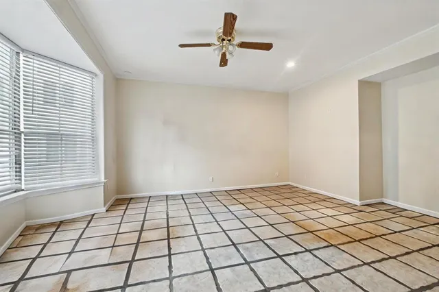 a view of an empty room and window