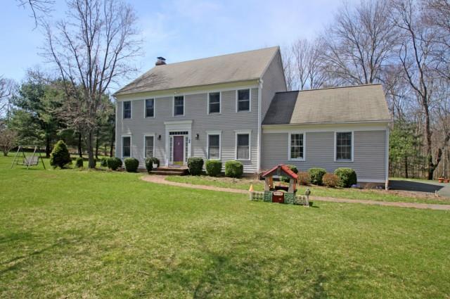 20 Cemetery Road Newtown, CT 06470 - Photo 1 of 1 a front view of house with outdoor seating yard and green space