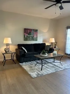 a living room with furniture and a fireplace