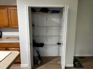 a close up of a storage and utility room with washer and dryer