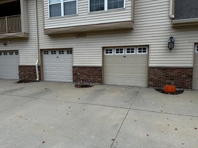 a view of a house with parking space in back