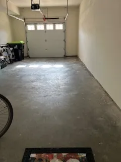 a view of a porch with furniture and garden