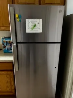 a view of a refrigerator in kitchen