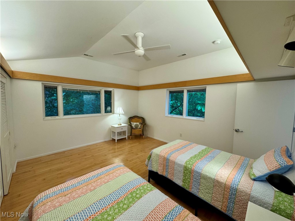 3559 Birchtree Path Cleveland, OH 44121 - Photo 23 of 37 Bedroom featuring wood finished floors, lofted ceiling, and a ceiling fan