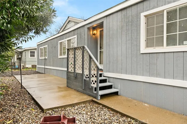 a view of a house with a backyard