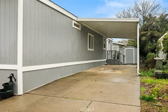 a view of staircase with white walls and a window