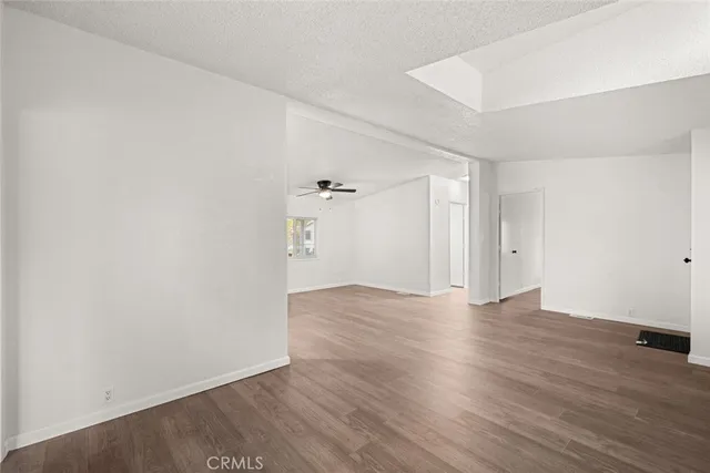 a view of kitchen with sink microwave and refrigerator