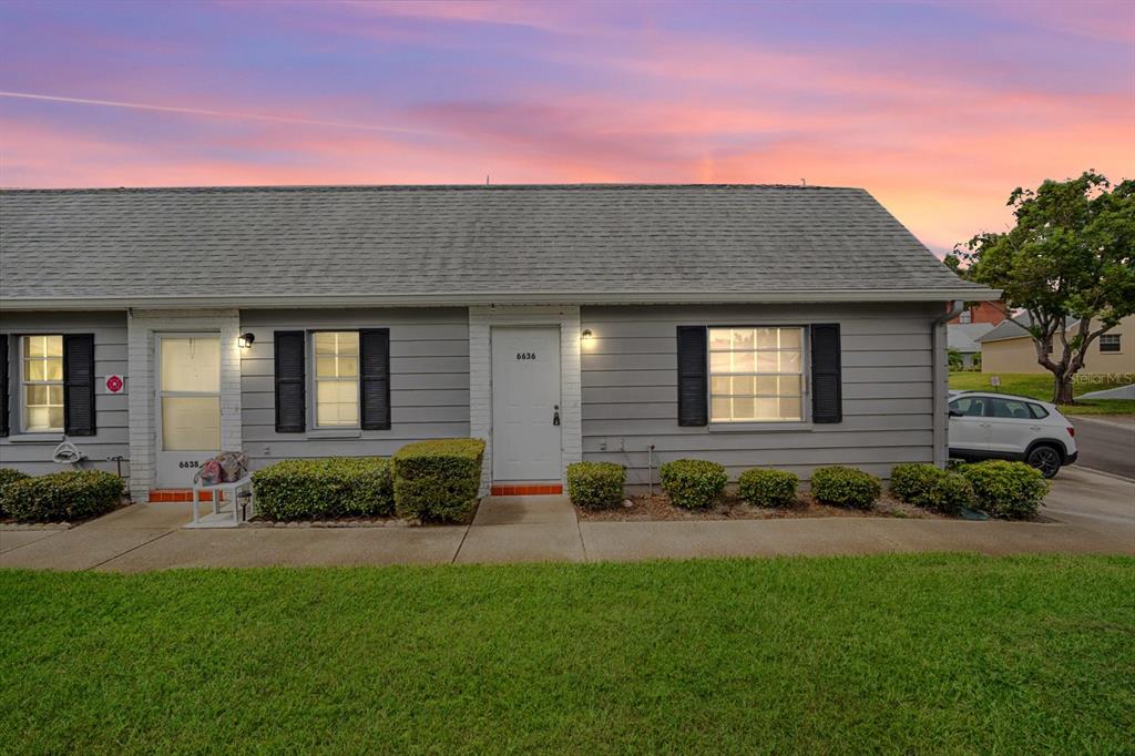 6636 Timbercove Lane New Port Richey, FL 34653 - Photo 1 of 20 a front view of a house with a garden