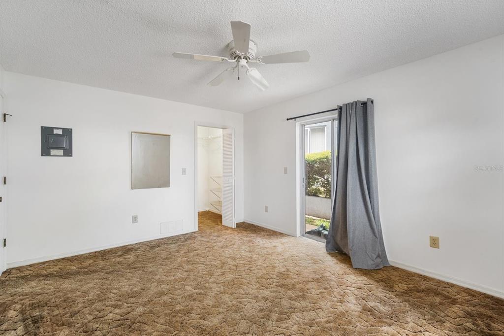 6636 Timbercove Lane New Port Richey, FL 34653 - Photo 12 of 20 a view of an empty room with window and chandelier fan