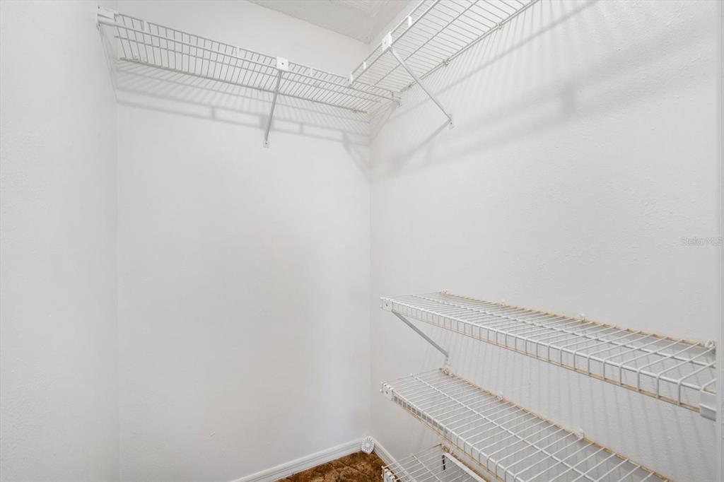 6636 Timbercove Lane New Port Richey, FL 34653 - Photo 13 of 20 a view of a room with racks on the wall