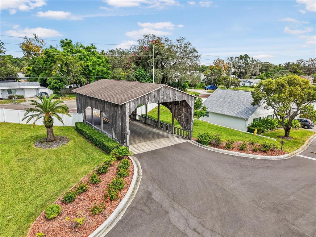 6636 Timbercove Lane New Port Richey, FL 34653 - Photo 17 of 20 an aerial view of a house with a garden and trees