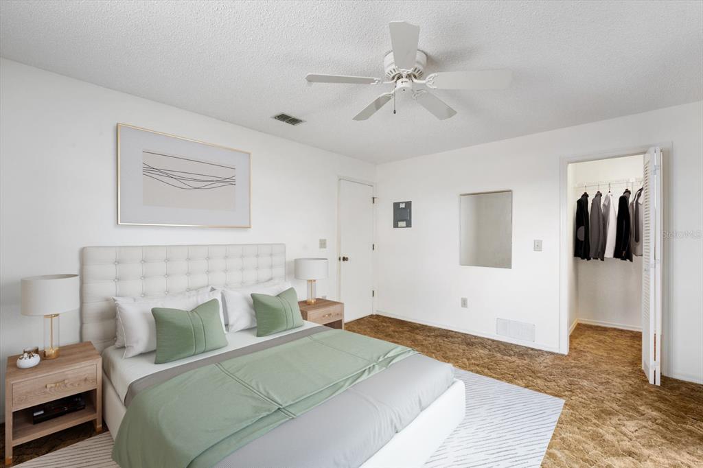 6636 Timbercove Lane New Port Richey, FL 34653 - Photo 10 of 20 a bedroom with a bed and wooden floor