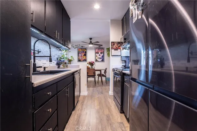 a kitchen with stainless steel appliances granite countertop lots of counter top space