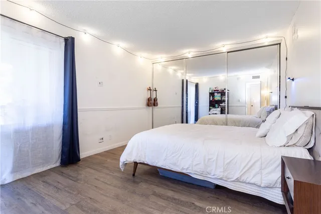 a spacious bedroom with a bed and a table