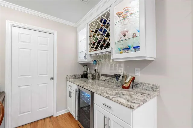 a kitchen with stainless steel appliances granite countertop a sink and dishwasher with wooden floor