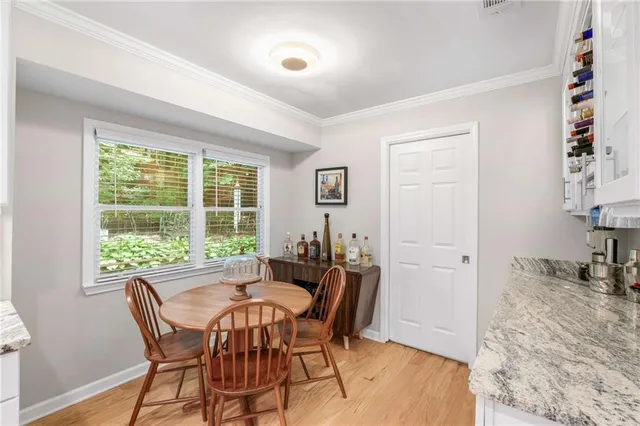 a view of a dining room with furniture window and outside view