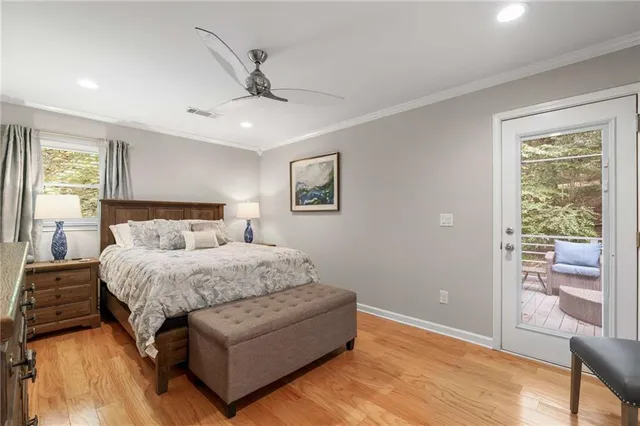 a spacious bedroom with a bed and a window