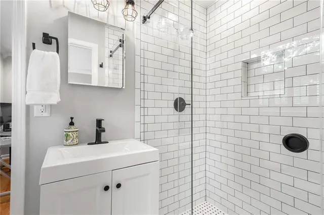 a bathroom with a sink toilet and shower