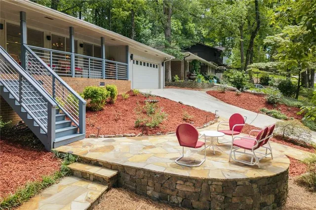 a view of a chairs and table in the patio