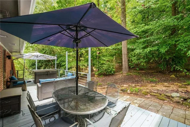 a backyard of a house with table and chairs