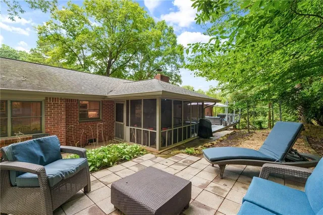 a view of a patio with couches chairs and a fire pit