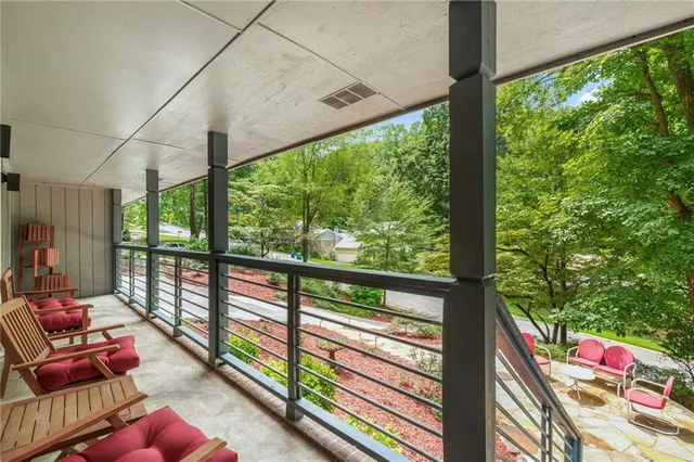 a room with furniture and a large window