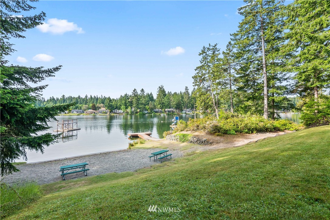 8810 Johnson Road Anderson Island, WA 98303 - Photo 6 of 11 a view of a lake with houses in the background