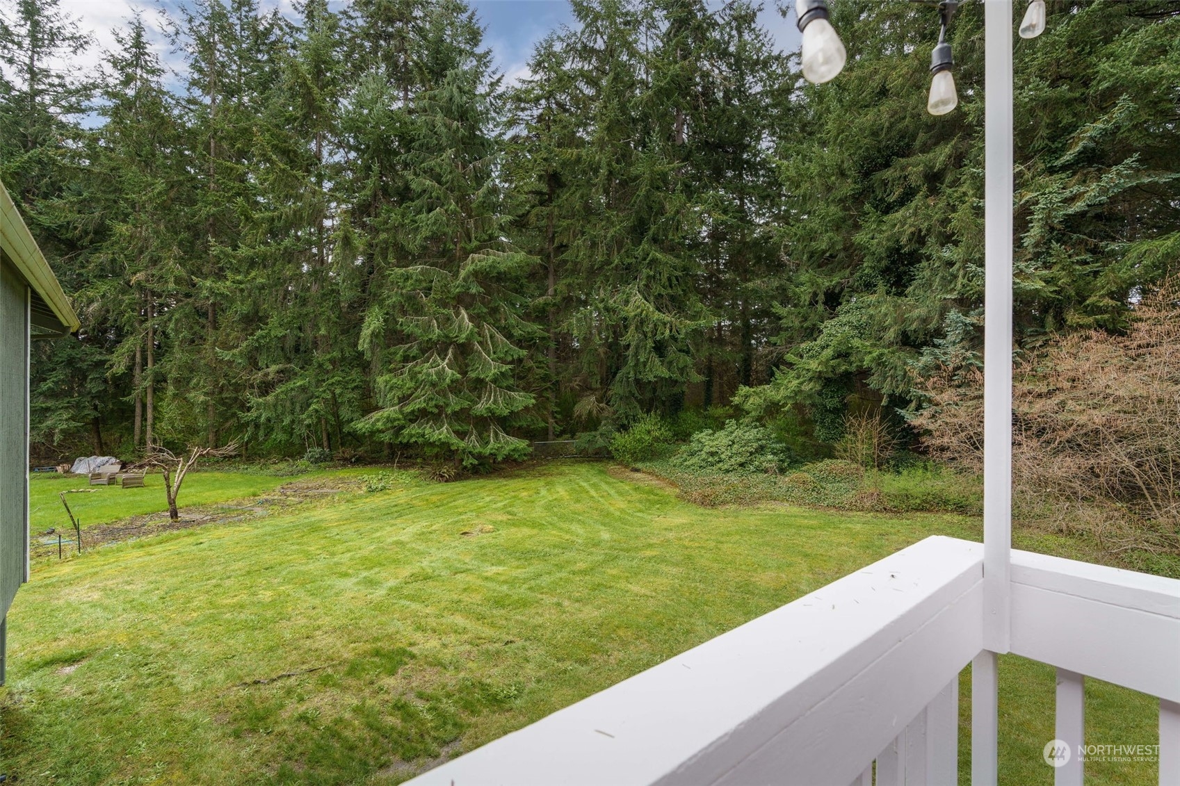 5033 Tri Lake Loop Southeast Olympia, WA 98513 - Photo 11 of 34 a view of outdoor space with deck and yard