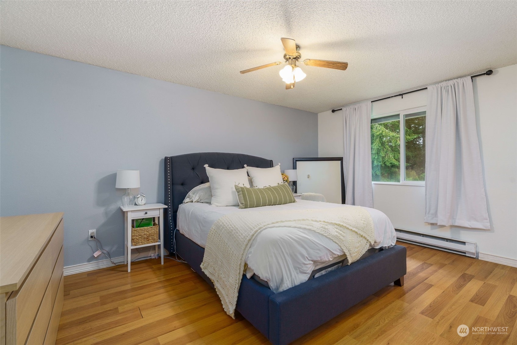 5033 Tri Lake Loop Southeast Olympia, WA 98513 - Photo 16 of 34 a bedroom with a bed and window