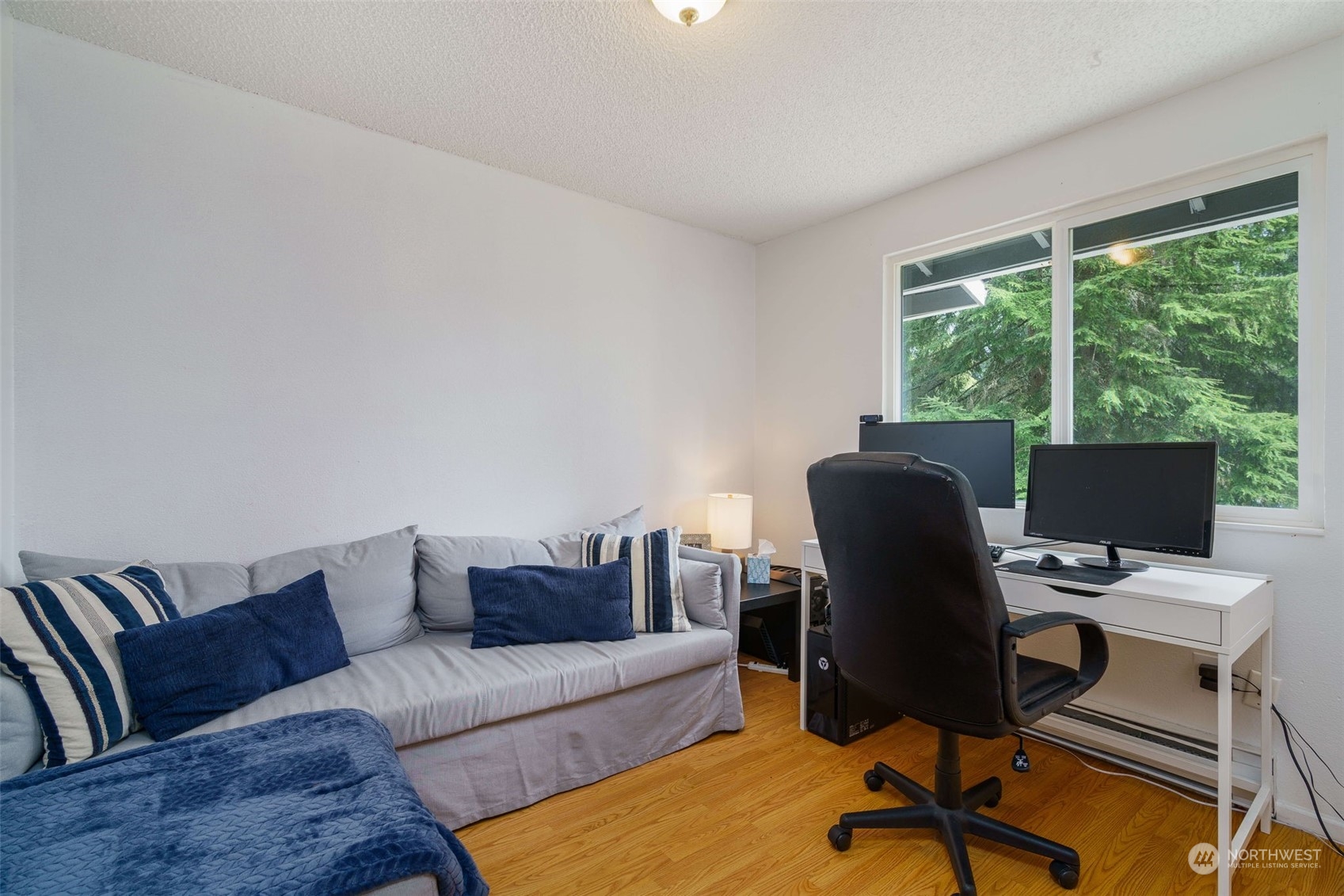 5033 Tri Lake Loop Southeast Olympia, WA 98513 - Photo 21 of 34 a view of a livingroom with workspace and a couch
