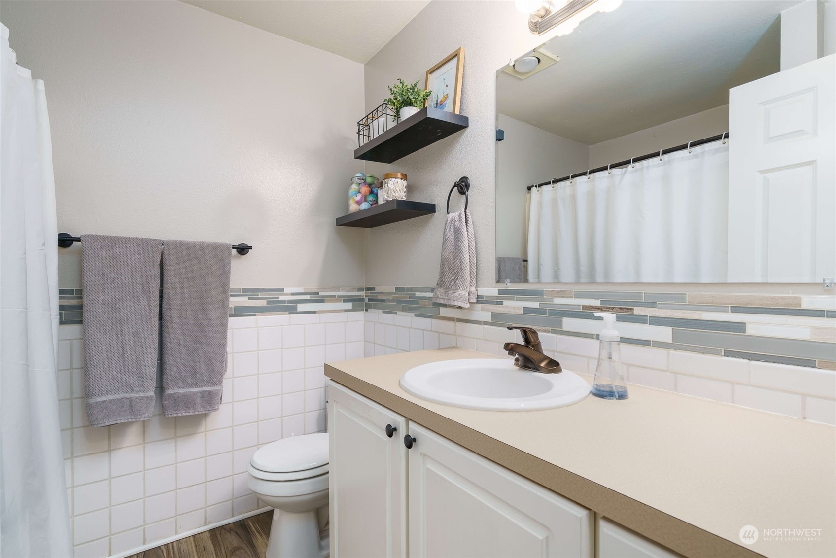5033 Tri Lake Loop Southeast Olympia, WA 98513 - Photo 22 of 34 a bathroom with a sink and toilet