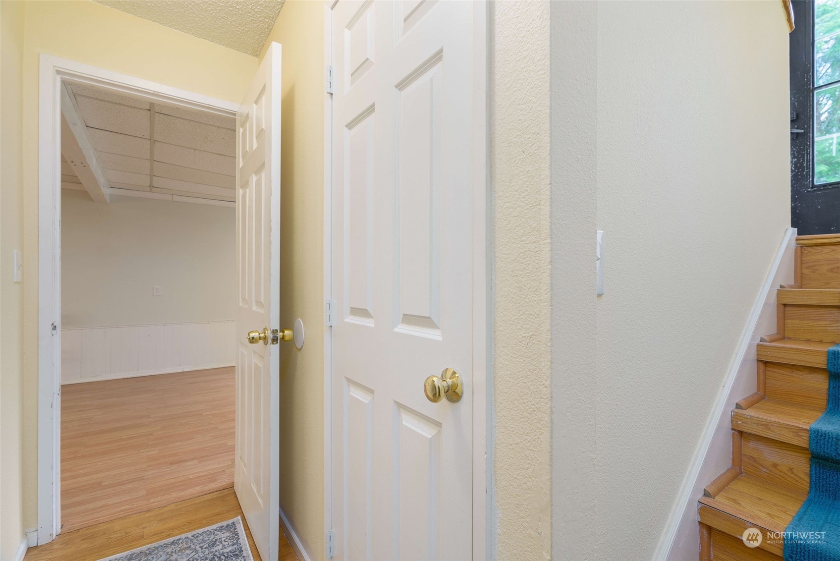 5033 Tri Lake Loop Southeast Olympia, WA 98513 - Photo 23 of 34 a view of a hallway with wooden floor and entryway