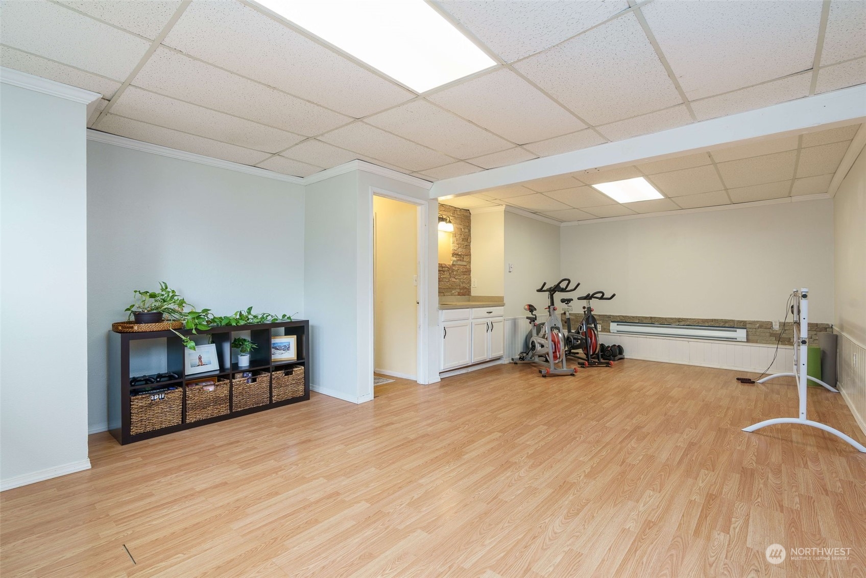 5033 Tri Lake Loop Southeast Olympia, WA 98513 - Photo 24 of 34 a view of a room with gym equipment and large windows