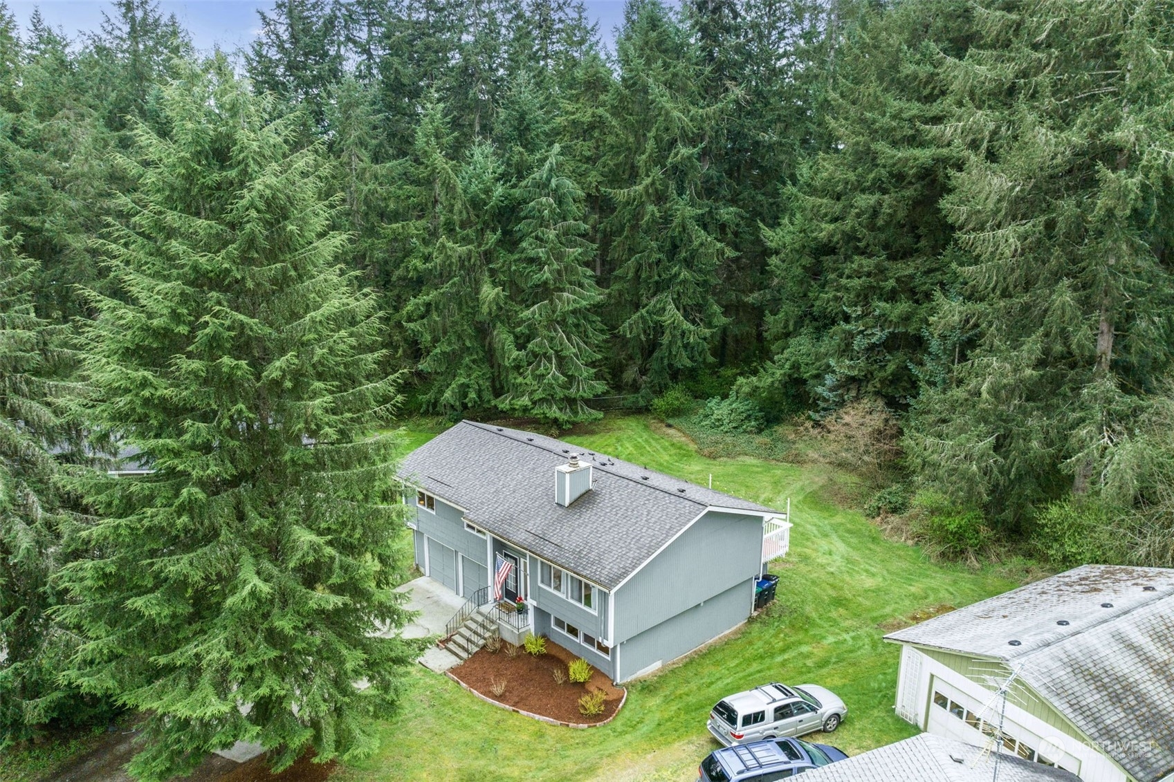 5033 Tri Lake Loop Southeast Olympia, WA 98513 - Photo 3 of 34 an aerial view of a house with a yard