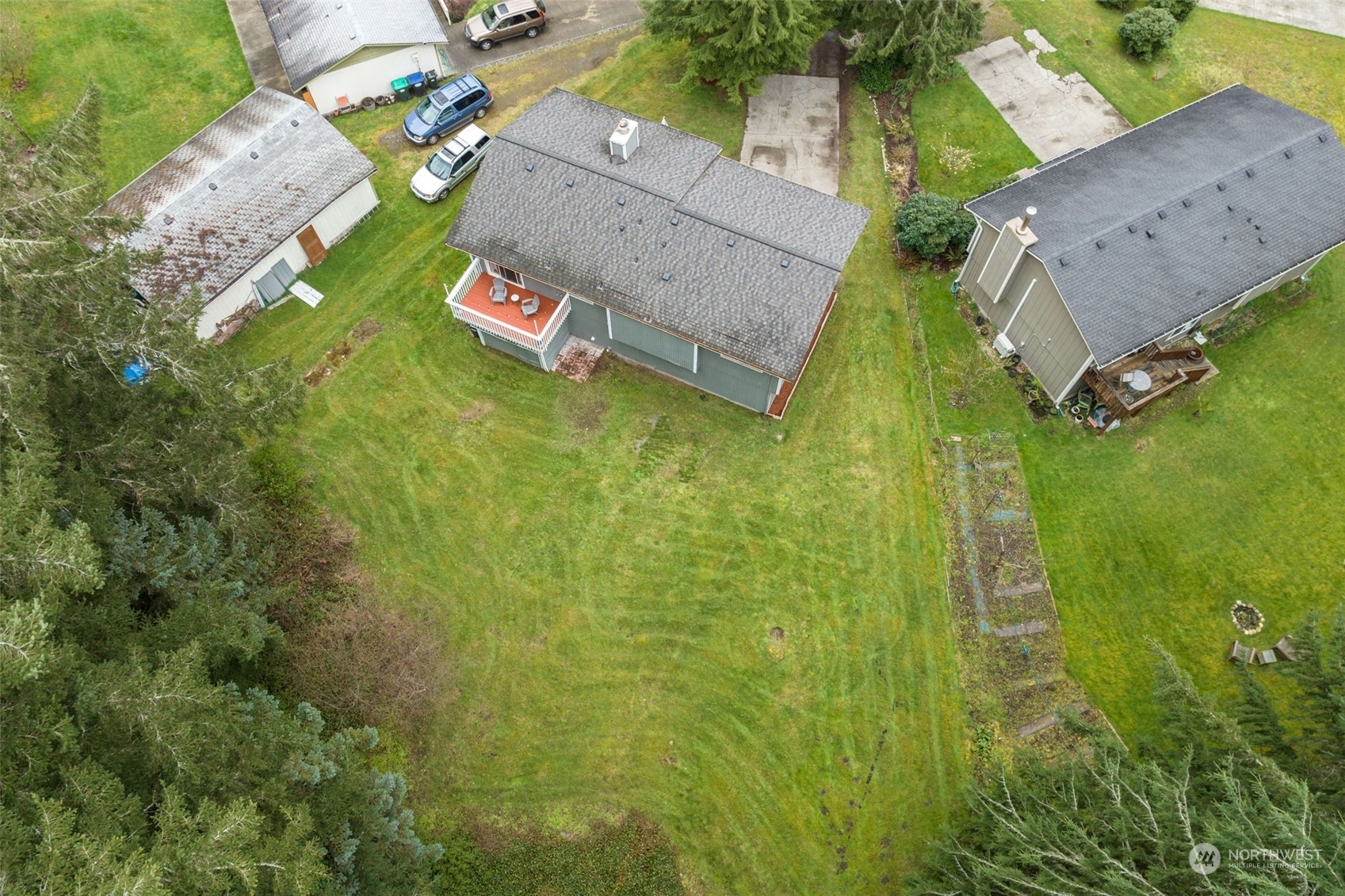 5033 Tri Lake Loop Southeast Olympia, WA 98513 - Photo 31 of 34 an aerial view of a house with a yard
