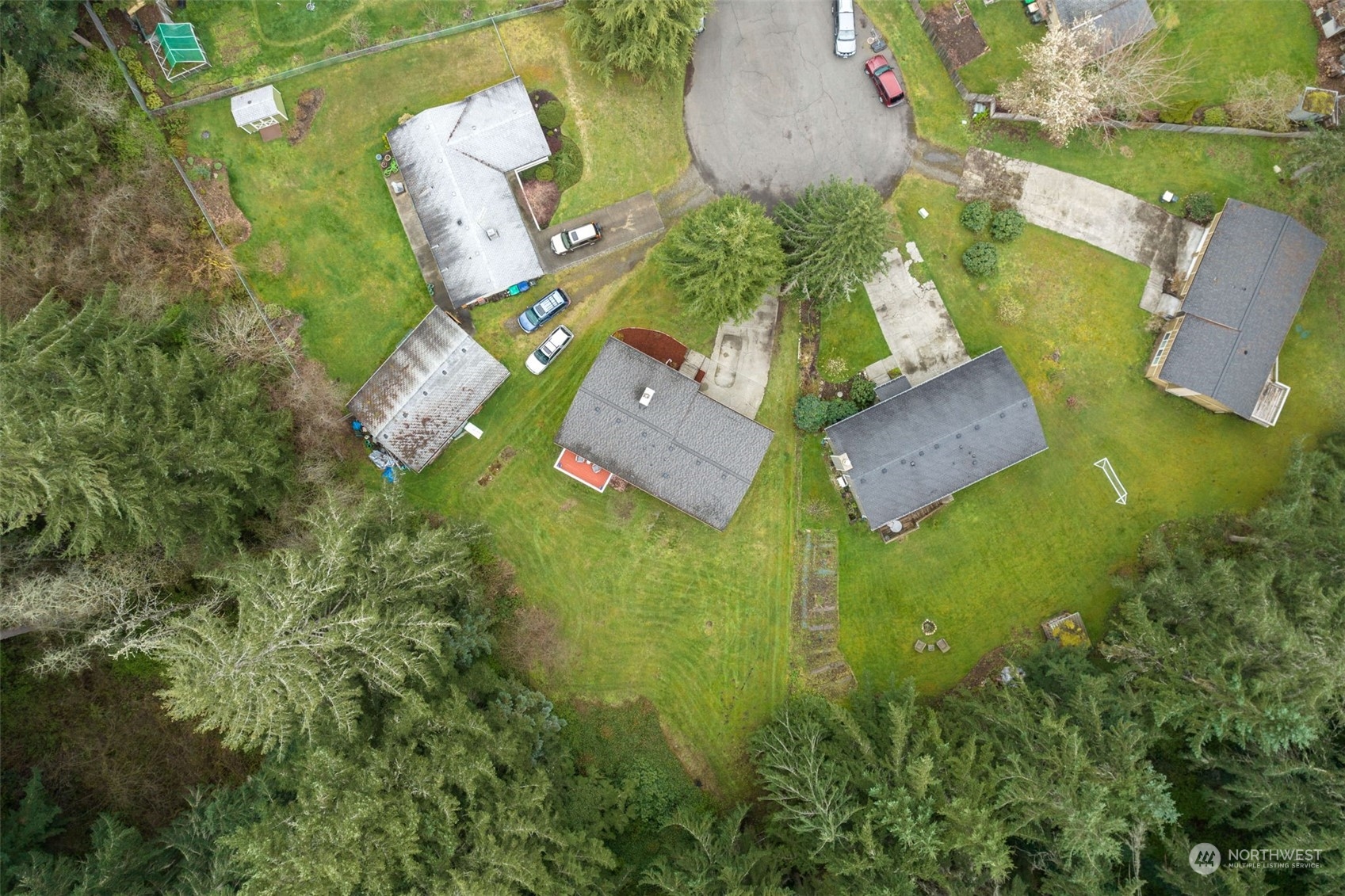 5033 Tri Lake Loop Southeast Olympia, WA 98513 - Photo 34 of 34 an aerial view of residential houses with outdoor space and trees