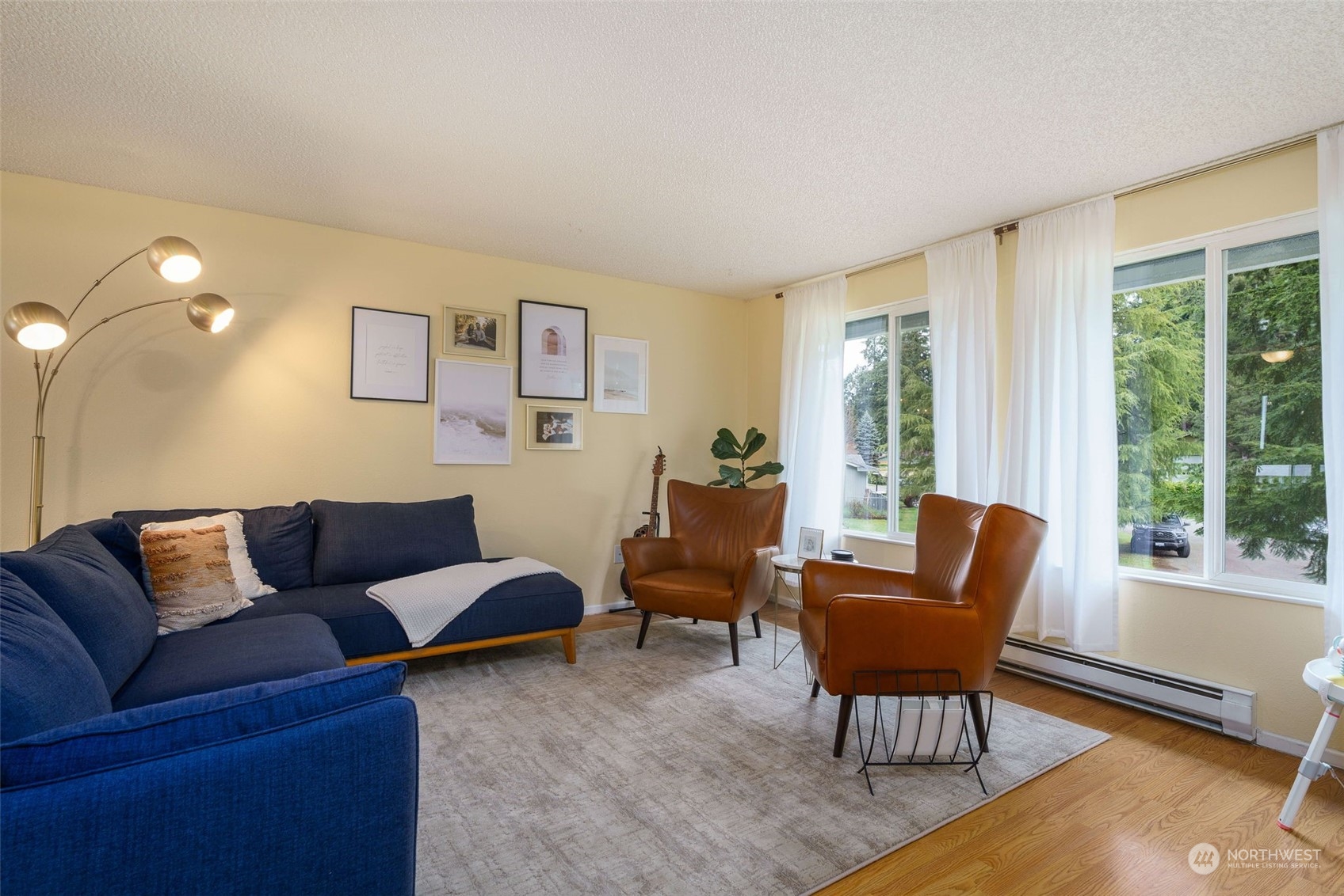 5033 Tri Lake Loop Southeast Olympia, WA 98513 - Photo 6 of 34 a living room with furniture and a large window