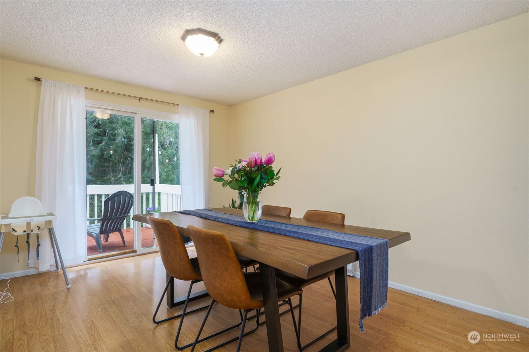 5033 Tri Lake Loop Southeast Olympia, WA 98513 - Photo 9 of 34 a dining room with furniture and wooden floor